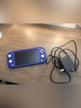 Nintendo Switch Lite Purple And Four Games
